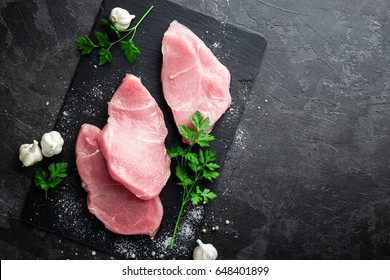 Raw Meat, Turkey Steaks On Black Background, Top View