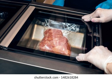 Raw Meat In A Vacuum Package. Evacuation Of Meat In A Vacuum. Close Up