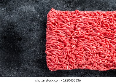 Raw Mince Beef Meat On A Kitchen Table. Black Background. Top View