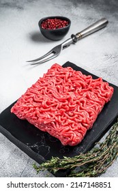 Raw Mince Minced Beef, Ground Meat With Thyme And Pepper. White Background. Top View.