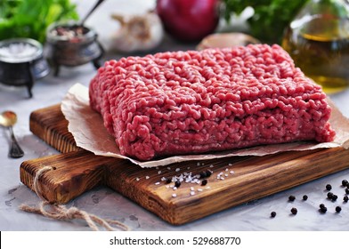 Raw Minced Beef On A Cutting Board.