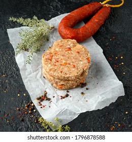 Raw Minced Chicken Meat And Chorizo Sausage Burger Patties With Herbs And Sea Salt