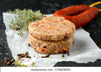 Raw Minced Chicken Meat And Chorizo Sausage Burger Patties With Herbs And Sea Salt