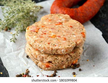 Raw Minced Chicken Meat And Chorizo Sausage Burger Patties With Herbs And Sea Salt