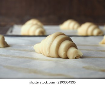 raw mini croissant rolls on baking paper - Powered by Shutterstock