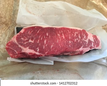 Raw New York Strip Loin. USDA Prime.