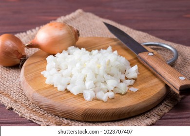 Raw onion, chopped very small cubes on a board - Powered by Shutterstock