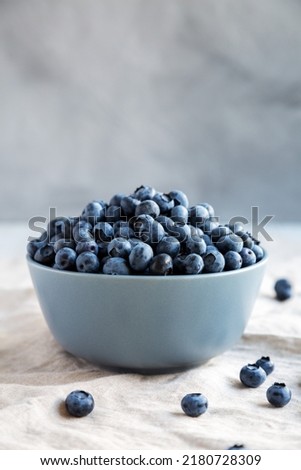 Raw Organic Blueberries in a Bowl, side view. 