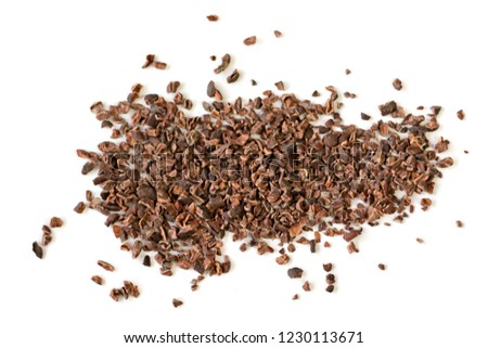 Raw organic cacao nibs on a white background.