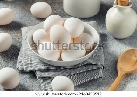 Raw Organic Cage Free White Eggs in a Group