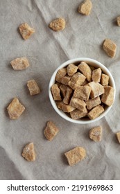 Raw Organic Demerara Granulated Brown Sugar In A Bowl, Top View. Flat Lay, Overhead, From Above. 