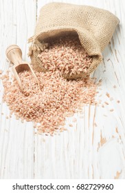 Raw Organic Devzira Rice on a white table. Selective focus - Shutterstock ID 682729960