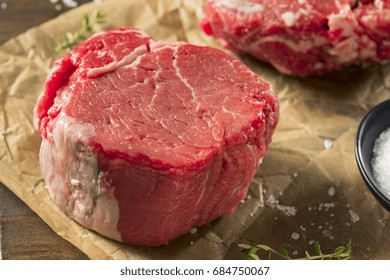 Raw Organic Grass Fed Filet Mignon Steak with Salt and Herbs