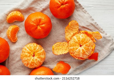 Raw Organic Mandarin Oranges On A White Wooden Table, Top View. Flat Lay, Overhead, From Above.Â 