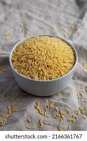 Raw Organic Risoni Pasta In A Bowl, Side View.