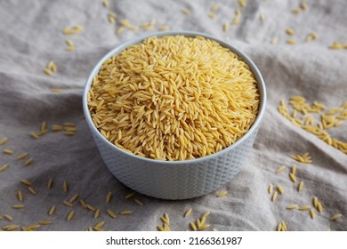 Raw Organic Risoni Pasta In A Bowl, Side View.