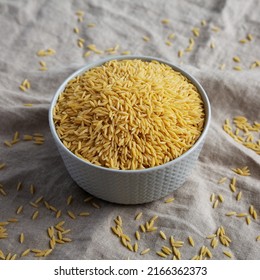 Raw Organic Risoni Pasta In A Bowl, Side View.