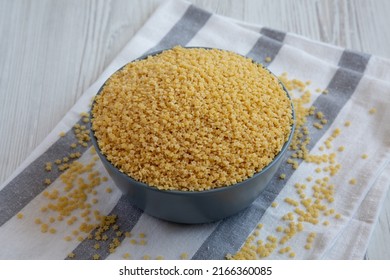 Raw Organic Stelline Pasta In A Bowl, Side View.