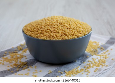 Raw Organic Stelline Pasta In A Bowl, Side View. Close-up.