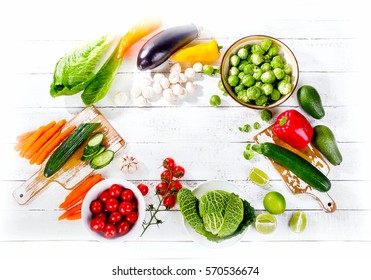 Raw organic vegetables  on white wooden background. Top view. Diet food concept.  - Shutterstock ID 570536674