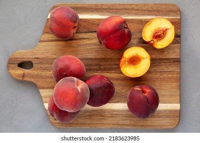 Raw Organic Yellow Peaches On A Wooden Board, Top View. Flat Lay, Overhead, From Above. 