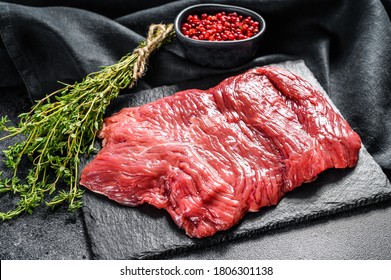 Raw Outside Skirt Steak, Marbled Meat. Black Background. Top View