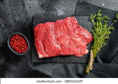 Raw Outside Skirt Steak, Marbled Meat. Black Background. Top View