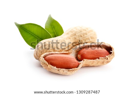 Raw peanuts on white background with green leaf. Healthy snack ona white background.Top view. close-up.