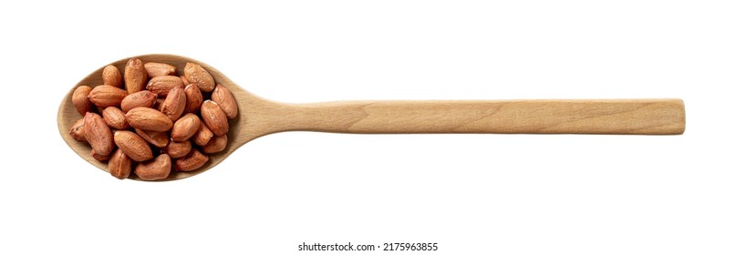 Raw Peeled Peanut In A Wooden Spoon Isolated On A White Background. Large Spoon Full Of Organic Groundnut Cutout. Arachis Hypogaea For Edible Seeds And Oil Crop. Vegetarian Snack. Top View.