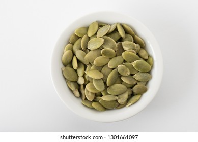 Raw Pepita Seeds In A White Bowl