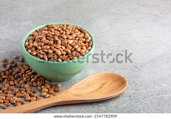 Raw pinto beans on the\
table.