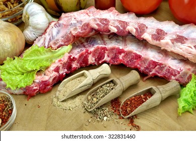 Raw Pork Baby Back Ribs On The Cutting Board Close-up