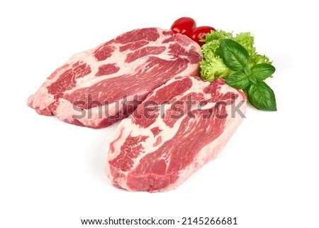 Raw pork Boston butt steaks, isolated on white background