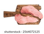 Raw pork fillet steaks, loin chops on a wooden board isolated on white background. top view.