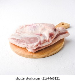 Raw Pork Jowl Meat On Brown Color Cutting Board in White Background