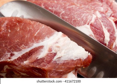 Raw pork meat close-up on a cutting board