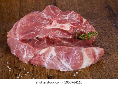 Raw Pork Meat Over Wooden Background