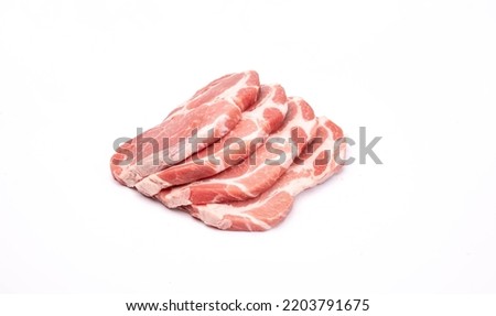 Raw pork neck chops, pork collar cutlets isolated on a white background. A packshot photo, for package design, template. 