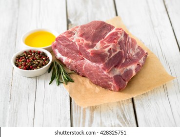 Raw Pork Neck Meat On Wooden Table