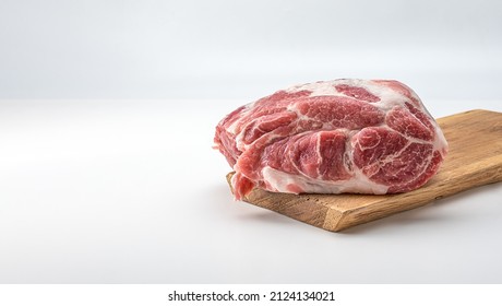 Raw pork on wooden board. Raw meat. Raw pork meat - neck or belly. Fresh meat on cutting board. piece of raw lamb meat. Butchery, market. isolated on white background