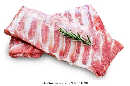 Raw  Pork ribs with a rosemary isolated on white