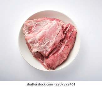 Raw Pork Shoulder Square Cut On White Plate