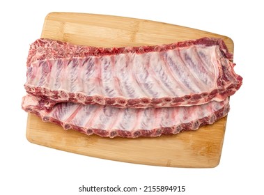 Raw pork spare loin ribs St Louis cut offered. closeup top view on wooden board. Racks of fresh raw pork meat ribs isolated on white background