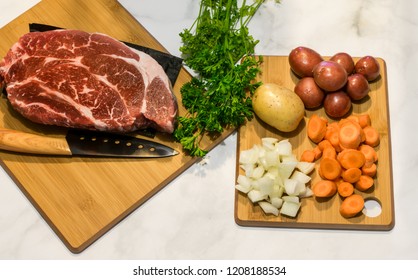 Raw Pot Roast With Onions, Potatoes, Carrots, And Parsley; Healthy Eating Concept; Hardy Food