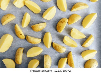 Raw Potato Wedges On Baking Tray 