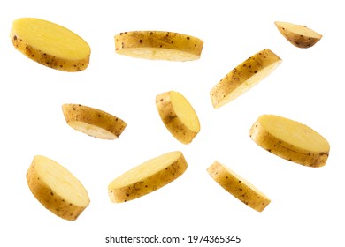 raw potatoes flying isolated on white background