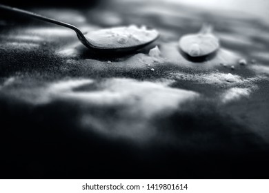 Raw Powdered Baking Soda In A Antique Spoon On Wooden Surface Along With Some More In A Plastic Spoon.Horizontal Shot.