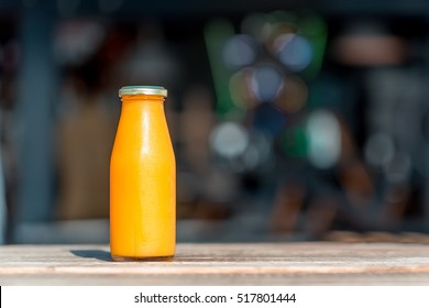 Raw pumpkin juice in glass bottle
