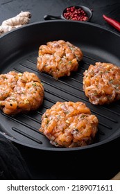 Raw Quick Asian Salmon Cutlet, On Black Textured Background