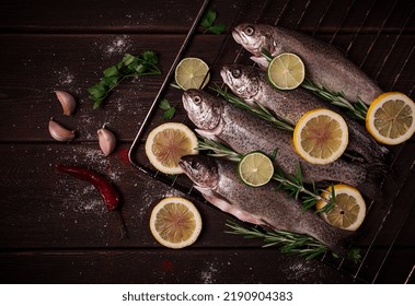 Raw Rainbow Trout, With Lemon And Herbs, On A Wooden Table, No People,